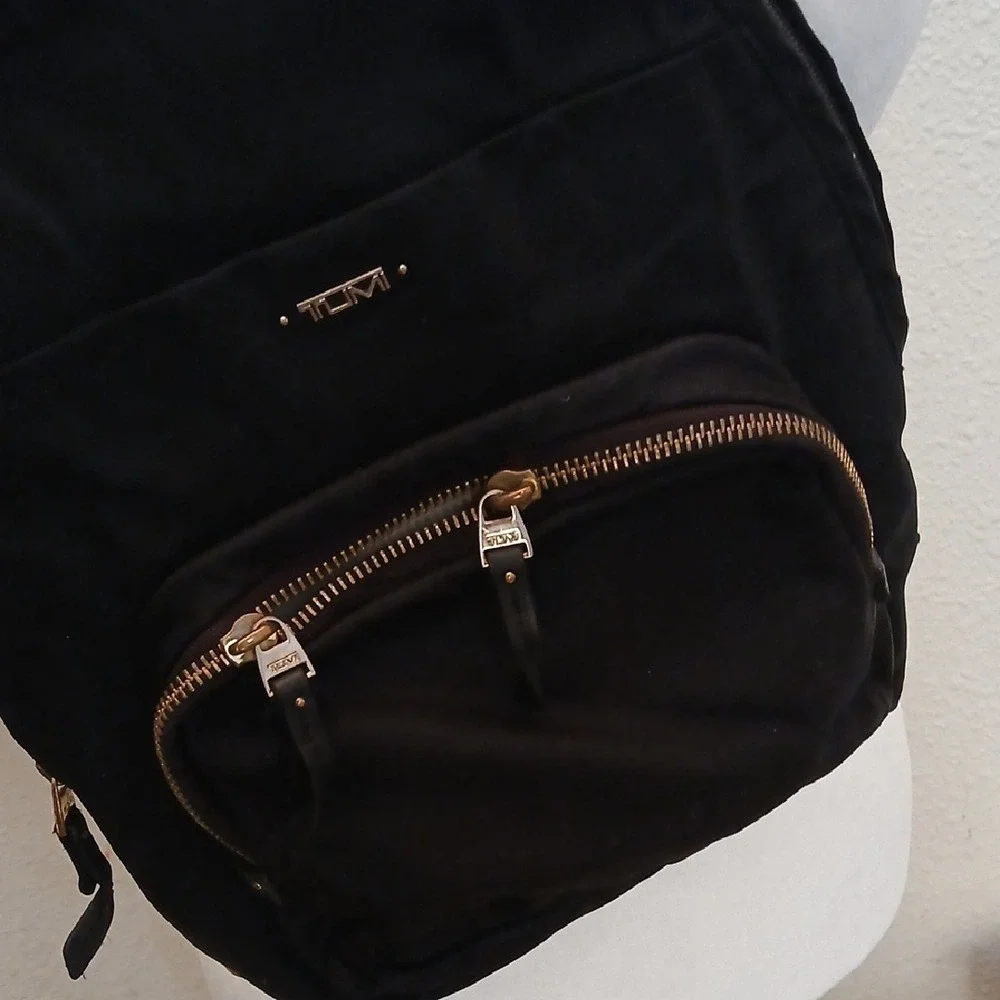 Tumi Black Belt Bag with Gold Accents